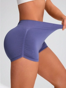 Detail of high-waisted seamless purple yoga shorts featuring a scrunch butt lifting design