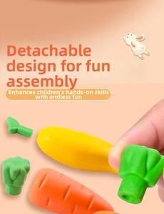 Close-up of detachable vegetable erasers showing carrot and corn puzzle components