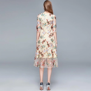 Back view of luxury embroidered mesh dress with colorful floral patterns and slim fit waist