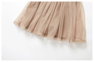 Detailed macro view of the layered apricot breathable mesh fabric on this tennis skirt