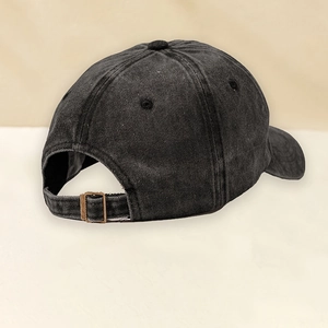 Rear view of vintage black washed denim baseball cap with adjustable metal buckle strap