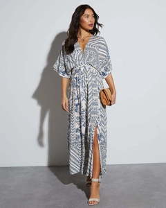 Detail view of Bohemian V-neck maxi dress featuring blue floral prints and side leg slit