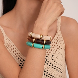Three-piece acrylic bamboo stretch bracelet set in marble, tortoiseshell and teal patterns