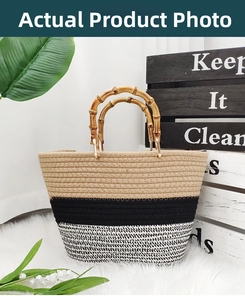 Detail view of woven cotton rope handbag with bamboo handles on white carpet