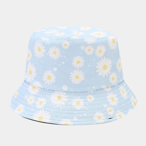 Close-up of light blue cotton daisy bucket hat with detailed stitching and floral print