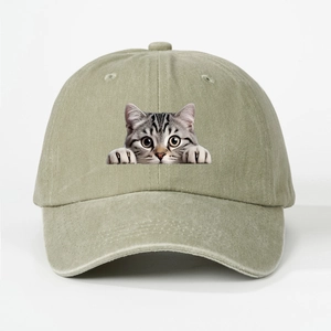 Close-up of olive washed cotton baseball cap featuring realistic gray tabby cat print detail