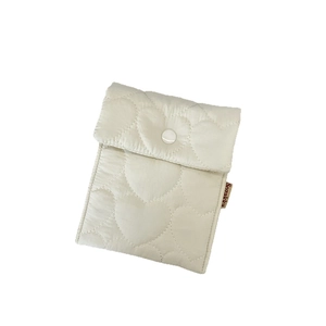 Quilted cream puppy sanitary napkin storage pouch with heart stitching and snap closure