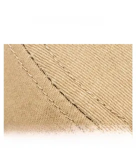 Macro detail of khaki twill cotton fabric with reinforced parallel stitching on flat top cap