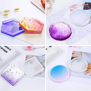Detail of geometric silicone molds for resin coasters in hexagon, round, and square shapes