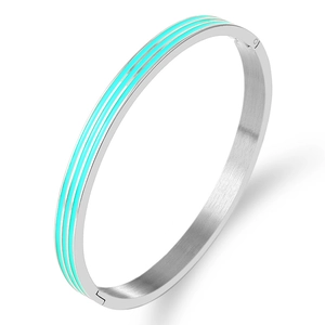 Detail view of silver stainless steel bangle with turquoise enamel triple stripe design
