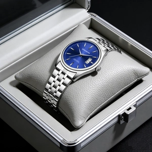 Close-up of blue sunray dial watch with date window and steel strap in a box