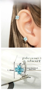 Detail view of light blue orchid copper zircon hoop earring with 8mm inner diameter dimensions