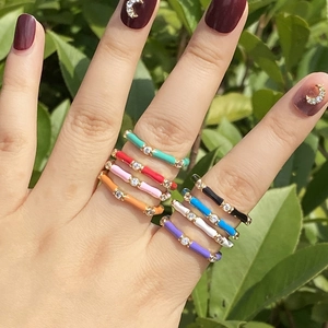 Set of 8 colorful enamel rings in gold finish with sparkling cubic zirconia stones