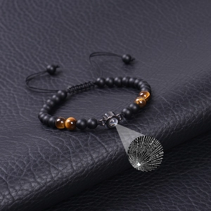 Detail showing the 100 languages I Love You projection stone with matte beads and tiger eye stones