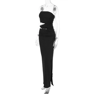 Detail of black strapless maxi dress featuring waist cut-out and elegant ruched fabric