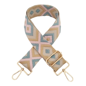 Detail of 5cm diamond jacquard strap with gold hardware and ethnic geometric patterns