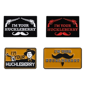 I'm Your Huckleberry enamel pins with pistols and bearded figure designs in metal