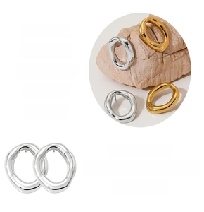 Detailed feature display of irregular geometric hoop earrings in gold and silver finish