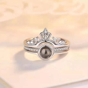 Macro shot of silver crown nesting ring set featuring micro-pave stones and projection stone
