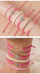 Detail of 5pcs set handmade woven turtle bracelets for beach jewelry in pink and white