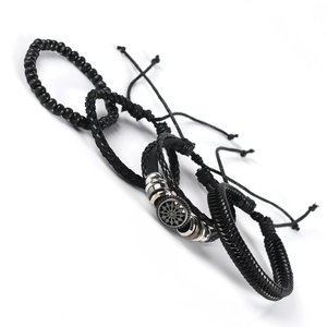 Set of four men's minimalist bracelets featuring black leather, beads, and metal star charm