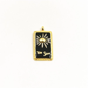 Golden sun tarot pendant in black enamel with 'The Sun' engraving, hip-hop style necklace