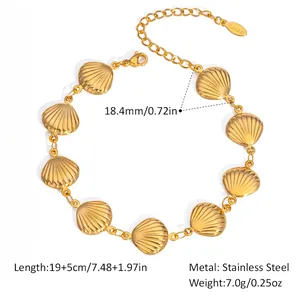 Detail view of golden shell link bracelet in stainless steel with lobster clasp and chain