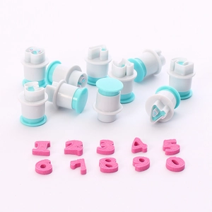 Set of 10 plastic number cookie cutters for baking showing numbers 0 to 9 in pink foam