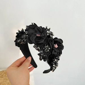 Detail of black floral headband with 3D fabric roses, beads and crystals