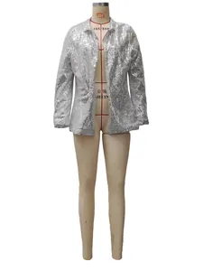 Detailed macro view of silver sequin blazer with lapel and refined shimmering texture