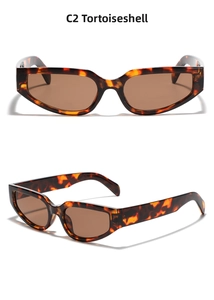 Detail view of Y2K oval sunglasses in C2 tortoise shell frame with tea lenses