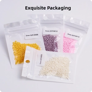 Macro detail of 3mm glass seed beads in colorful variety packs for DIY jewelry making