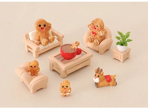 Miniature Christmas gingerbread man scene with resin reindeer and tiny furniture models