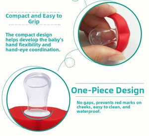 Detail of red lips baby pacifier showing one-piece silicone design and easy grip handle