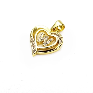 Close-up of golden heart pendant with sparkling zircon diamonds and the letter K detail