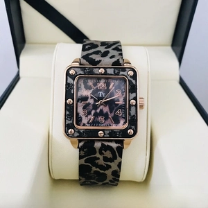 Close-up of square leopard print watch with rose gold case in a display box
