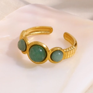 Close-up of three green aventurine stones on 18K gold plated stainless steel open ring
