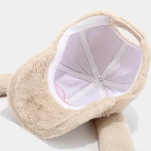 Internal view of plush baseball cap showing white fabric lining and stitched seams detail