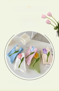 Close-up of five-color tulip embroidered cotton socks in blue white pink and green