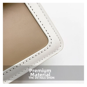Detail of premium textured leather with fine white stitching on a crossbody box bag