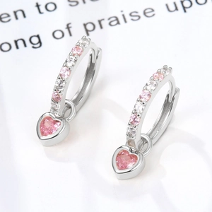 Detail view of S925 sterling silver hoop earrings with pink heart zircon stones