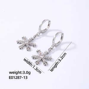 Detailed view of silver snowflake earrings with cubic zirconia and dimension labels