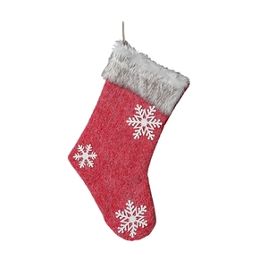 Red Christmas stocking with white snowflake patches and faux fur trim for holiday decoration