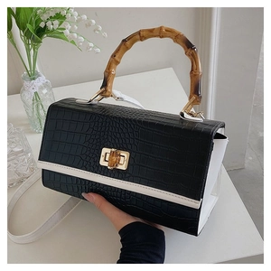 Detail of the crocodile pattern leather and distinctive bamboo handle with gold lock