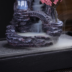 Chinese backflow incense burner with resin landscape bridge and pink tree scenery