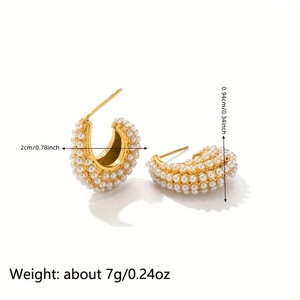 Detail view of gold C-shape shell earrings with pearls and precise dimensions
