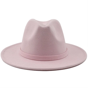 Detail of a pink wool felt wide brim fedora hat with matching decorative ribbon