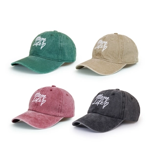 Washed cotton baseball caps in four colors featuring Mom Life embroidery and heart detail