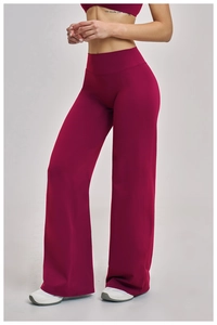 Detail of high-waisted dark rose wide-leg sports trousers with premium matte texture