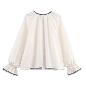 Off-white chiffon blouse with black wave trim on collar and flared sleeves